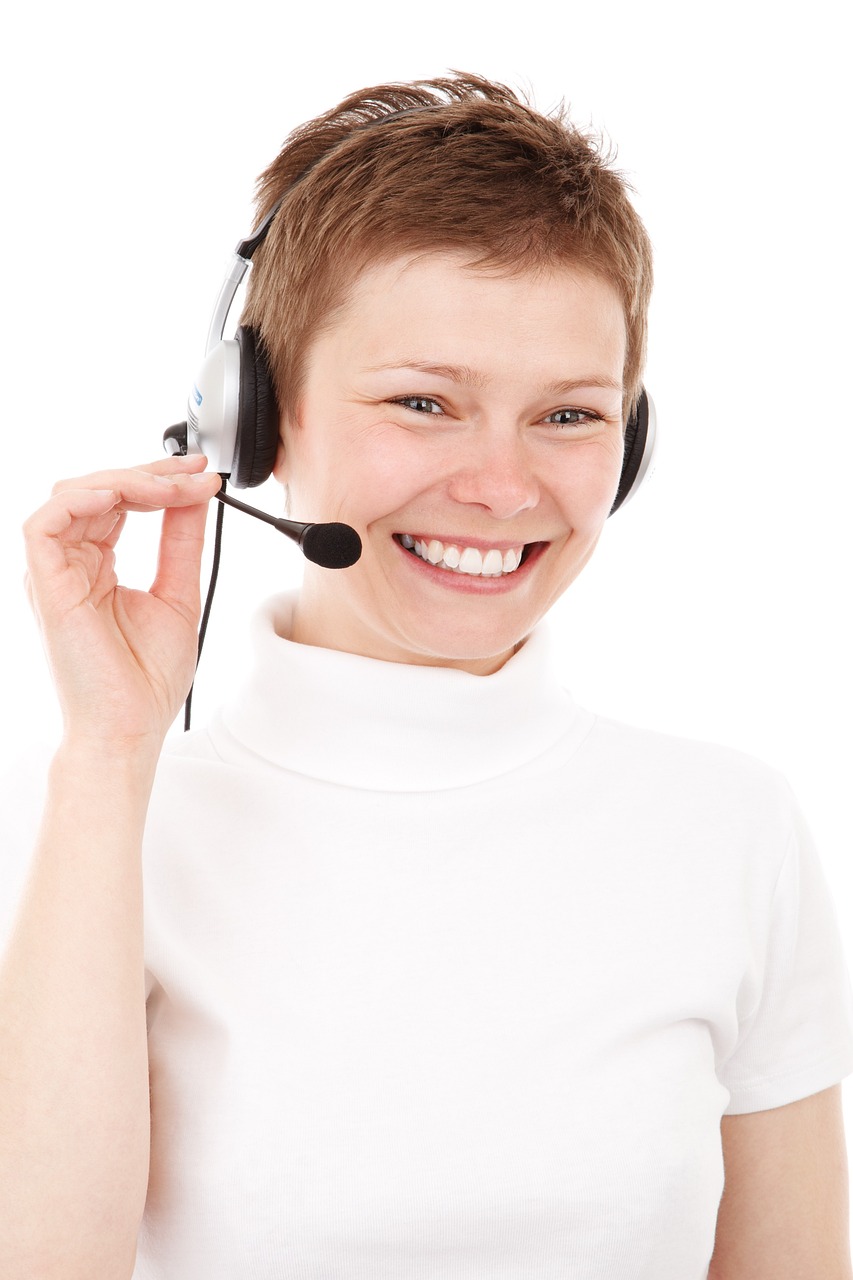 Female customer service support agent wearing a headset, ready to assist.